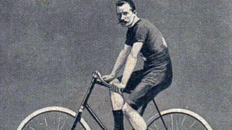 Vintage cycling image from the 19th century: Henri Desgrange, the founding father of the Tour de France posing as a young cyclist on his own bicycle.